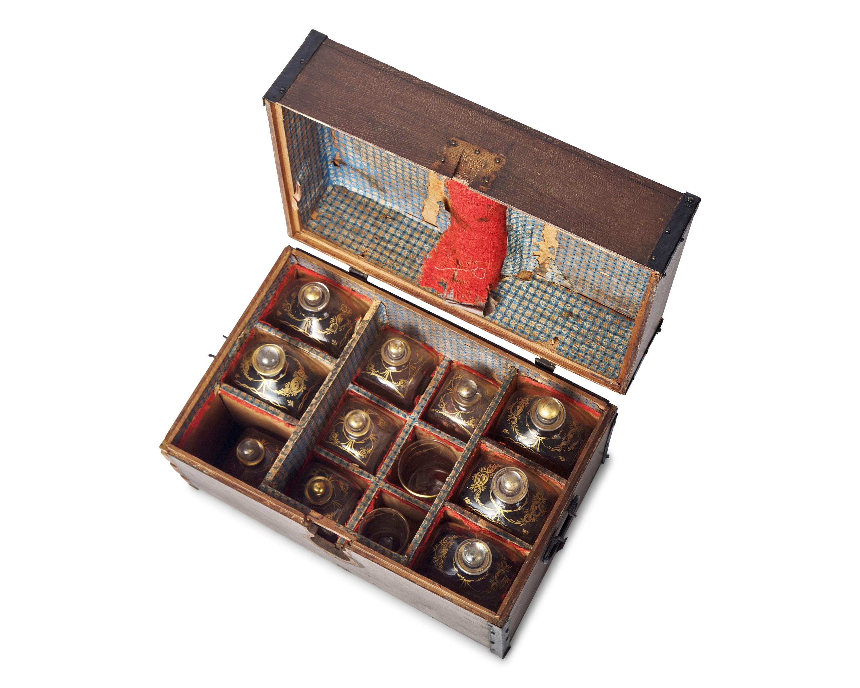 A Federal Oak Liquor Case Fitted with Gilt-Decorated Glass Bottles and Glasses