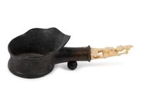A Chinese Silk Iron with a Figural Handle
