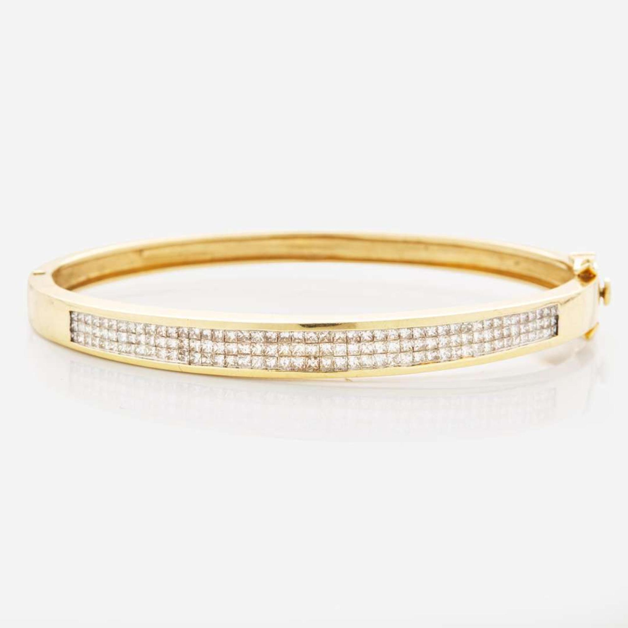 A 14K Yellow Gold and Diamond Bangel