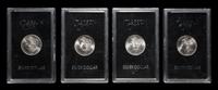 A Group of Four 1882-CC GSA: Morgan $1 Coins