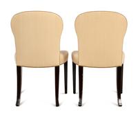 A Set of Eight Saddle Dining Chairs