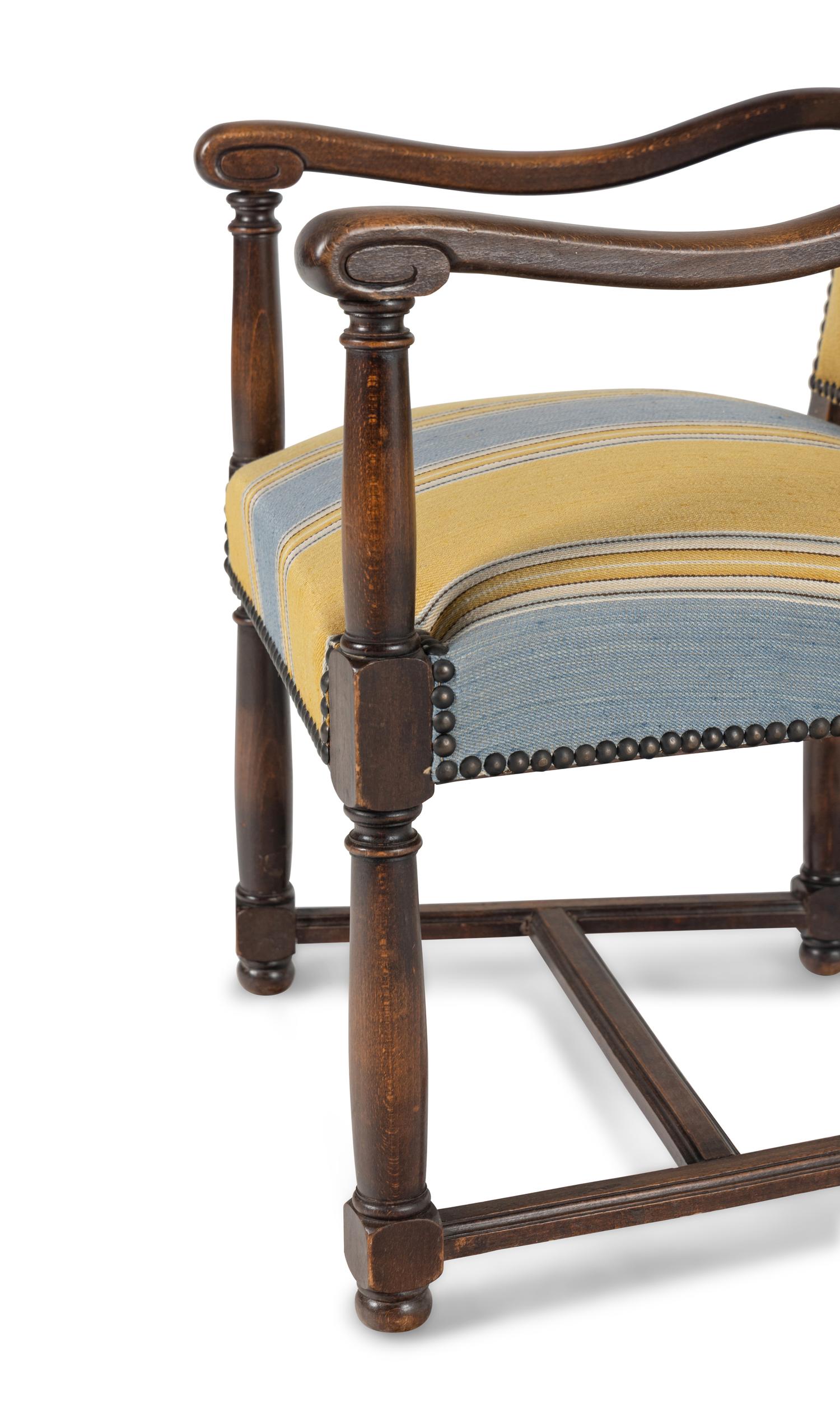 A Pair of French Provincial Carved Oak Fauteuils