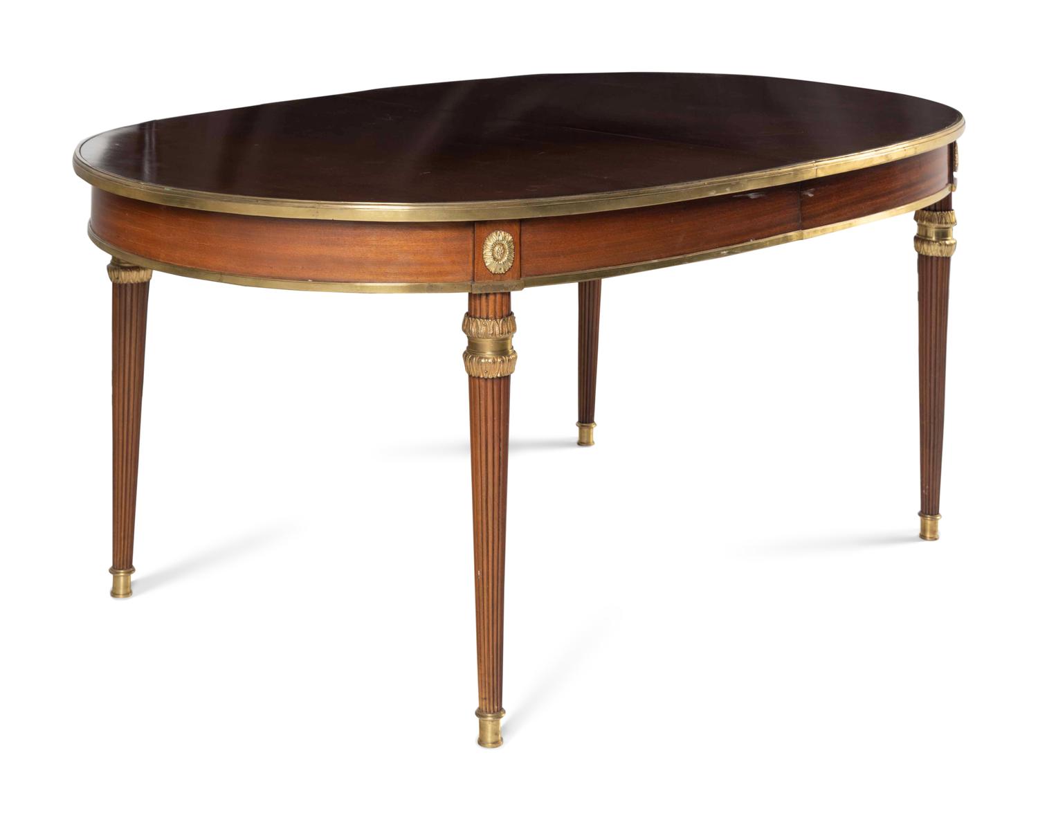 A Louis XVI Style Gilt Bronze Mounted Mahogany Dining Table