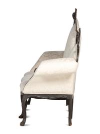 An Italian Carved and Black Painted Walnut High-Back Sofa