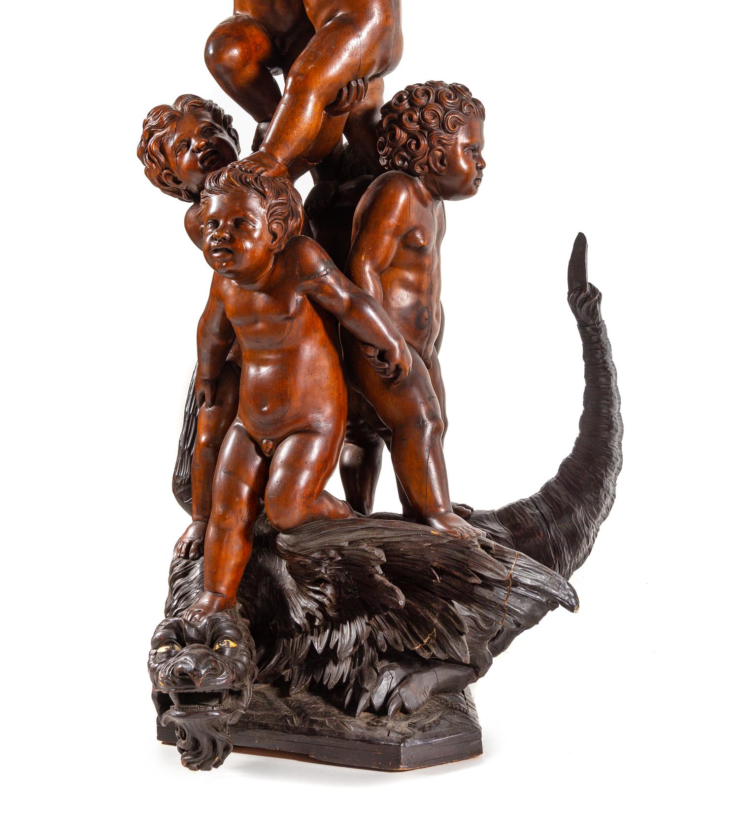 A Pair of Monumental Venetian Baroque Style Carved Walnut Torchères