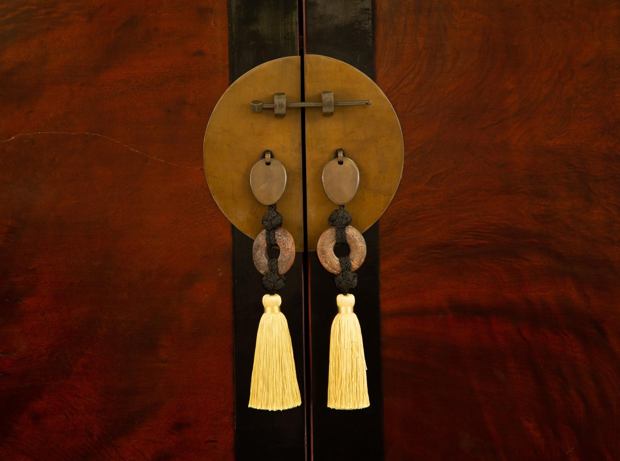 A Chinese Ming Style Black Lacquer and Elm Wood Cabinet