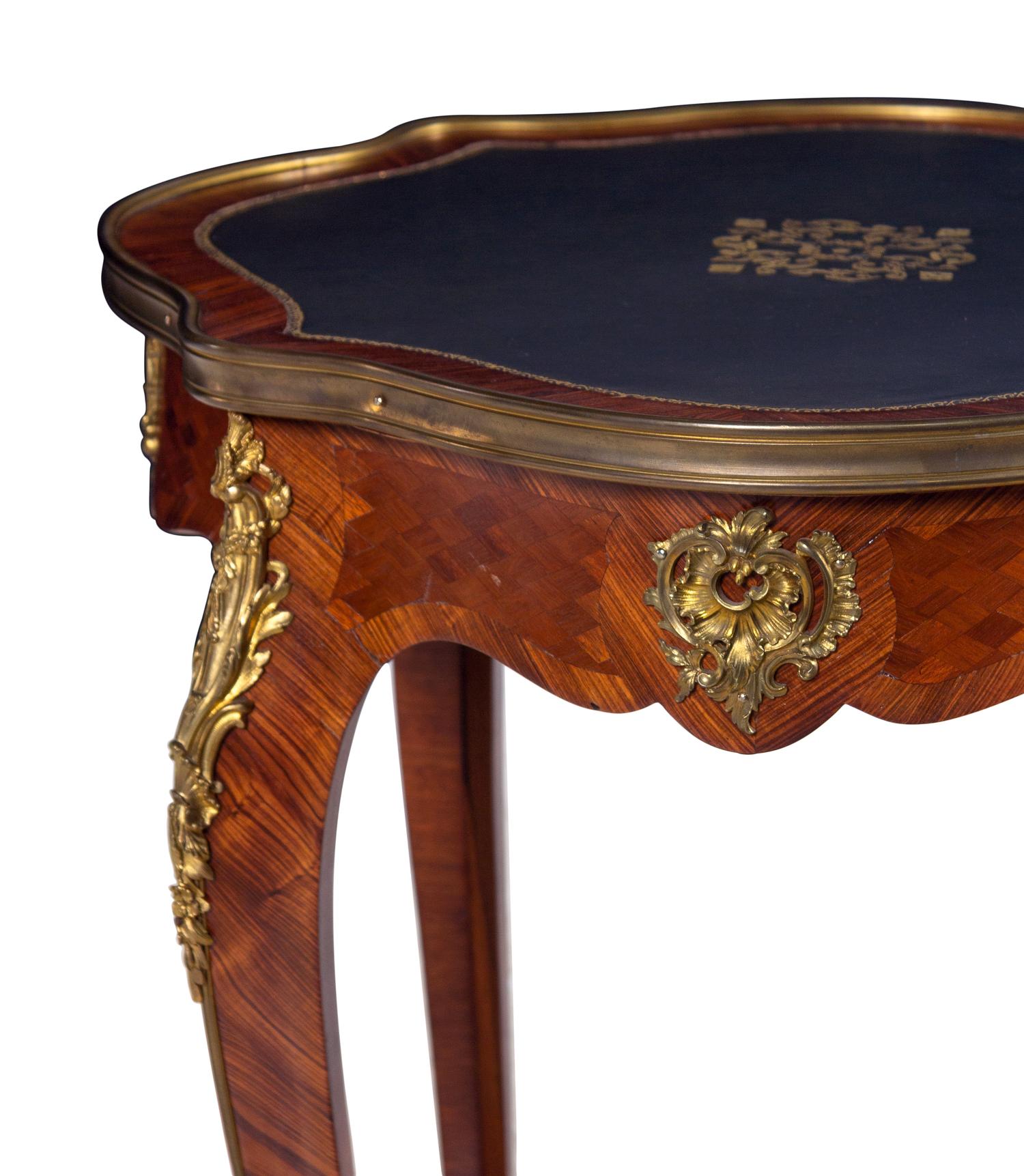 A Louis XV Style Gilt Bronze Mounted Kingwood and Parquetry Guéridon