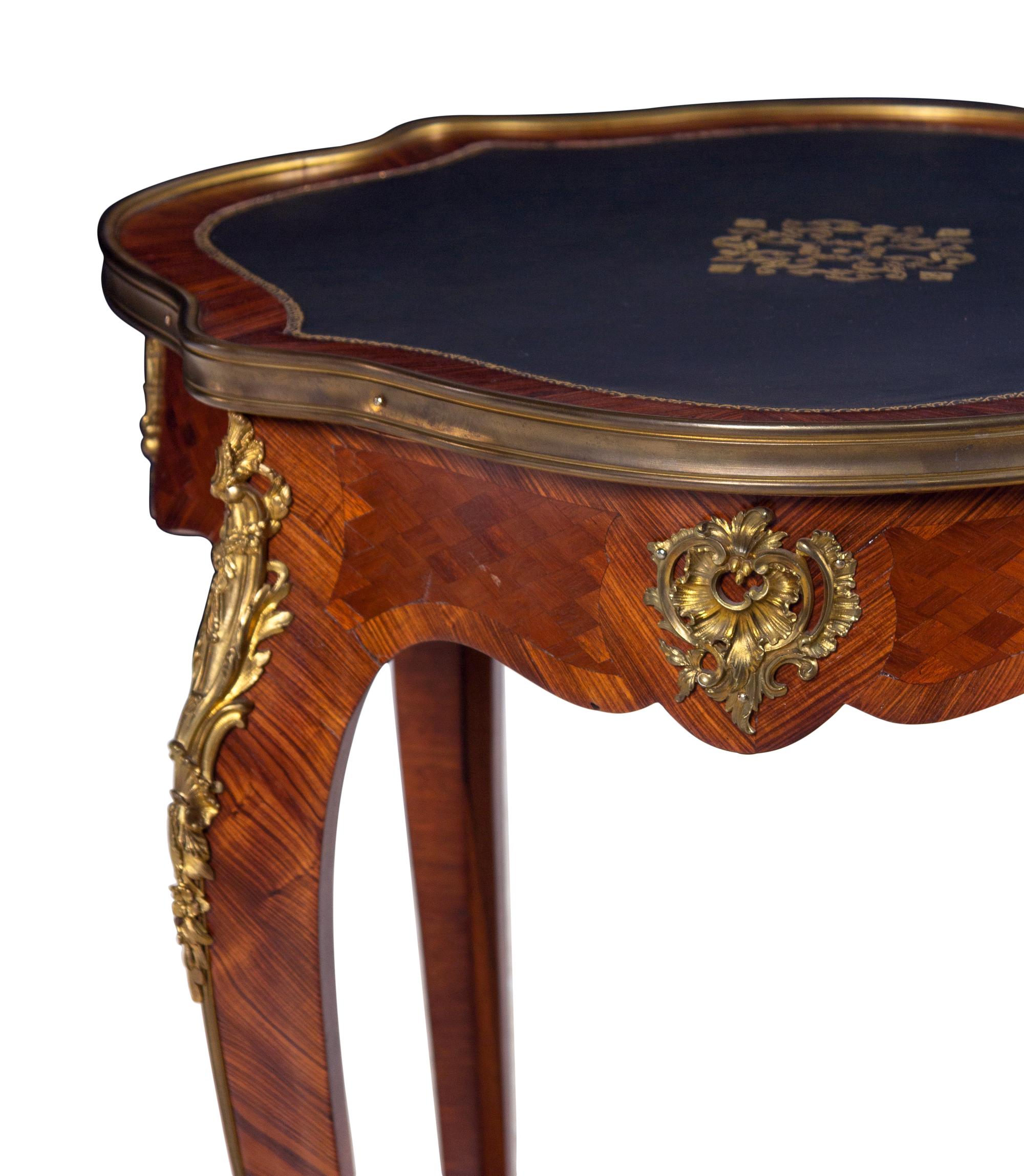 A Louis XV Style Gilt Bronze Mounted Kingwood and Parquetry Guéridon