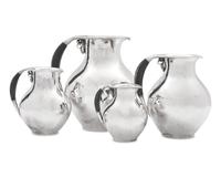 A Group of Four Georg Jensen Silver Pitchers
