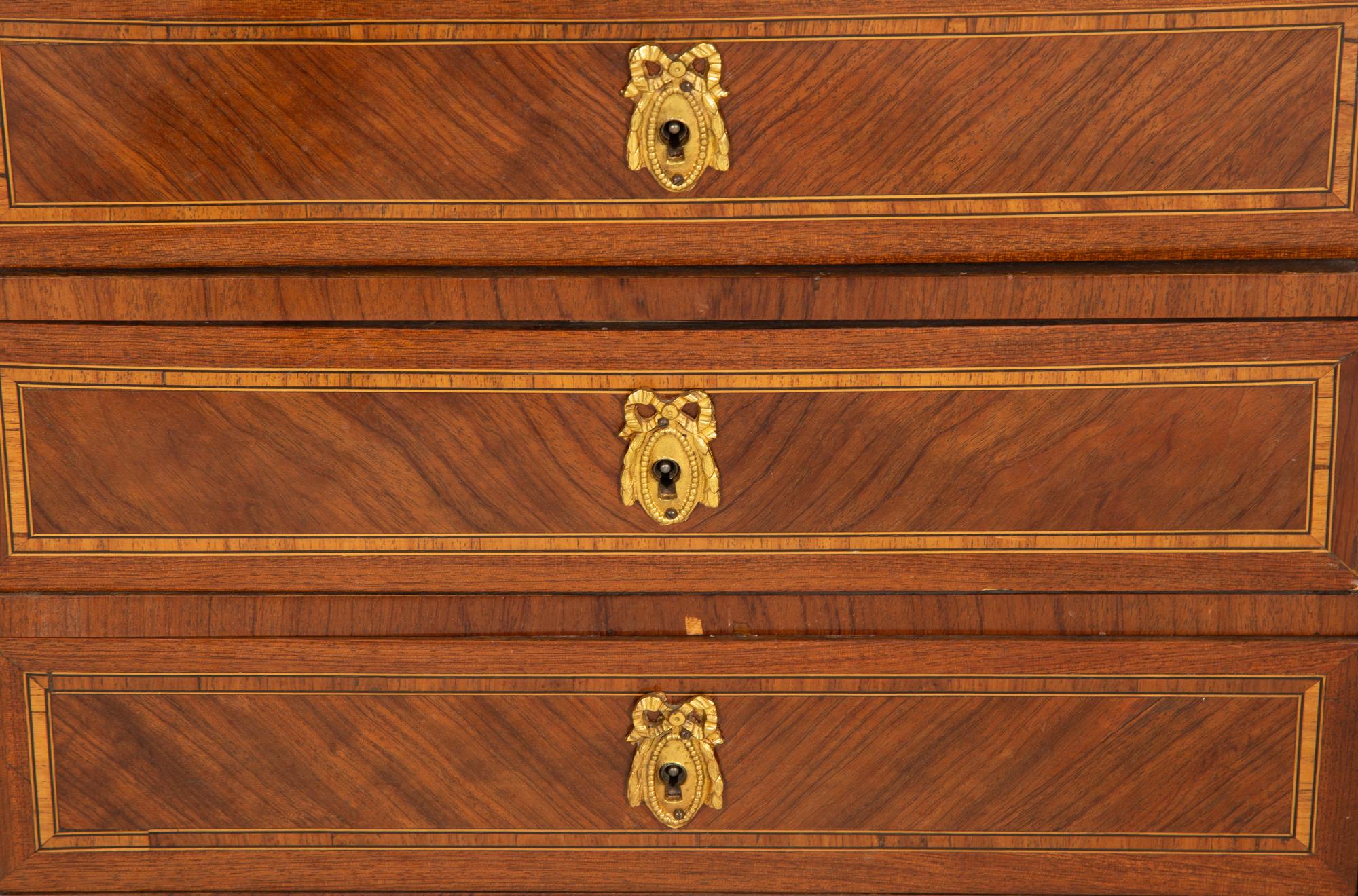 A Louis XV Kingwood and Tulipwood Parquetry Table en Chiffonier