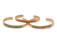 A Collection of Yellow Gold and Hardstone Cuff Bracelets, Regina Martinez,