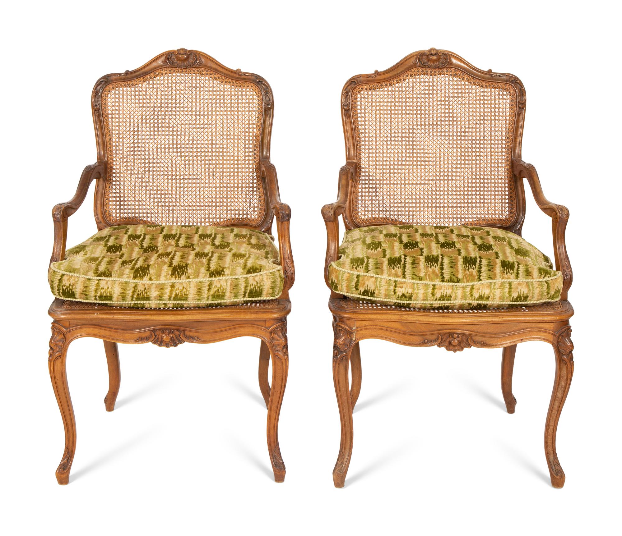 A Pair of Louis XV Style Caned Beechwood Fauteuils