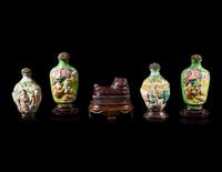 Four Chinese Famille Rose Porcelain Snuff Bottles and A Aubergine Glazed Porcelain Dog-Form Paper Weight