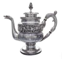 An American Silver Teapot, S. Kirk & Son, Baltimore, MD, 19th Century, having a foliate finial, the lid and body decorated with foliate