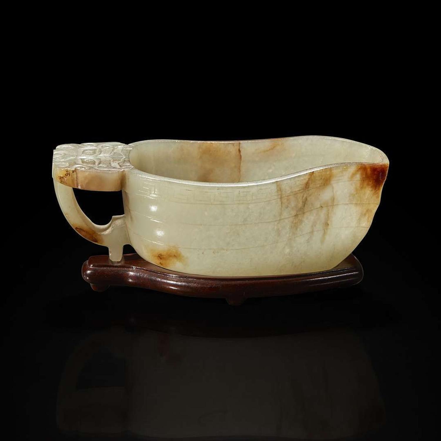 A Chinese pale celadon jade archaistic libation cup and a bronze rabbit seal 玉匜与铜兔印章一组 The jade 17th/18th Century, the seal possibly Yuan dynasty ?????????? ??????