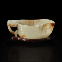 A Chinese pale celadon jade archaistic libation cup and a bronze rabbit seal 玉匜与铜兔印章一组 The jade 17th/18th Century, the seal possibly Yuan dynasty ?????????? ??????
