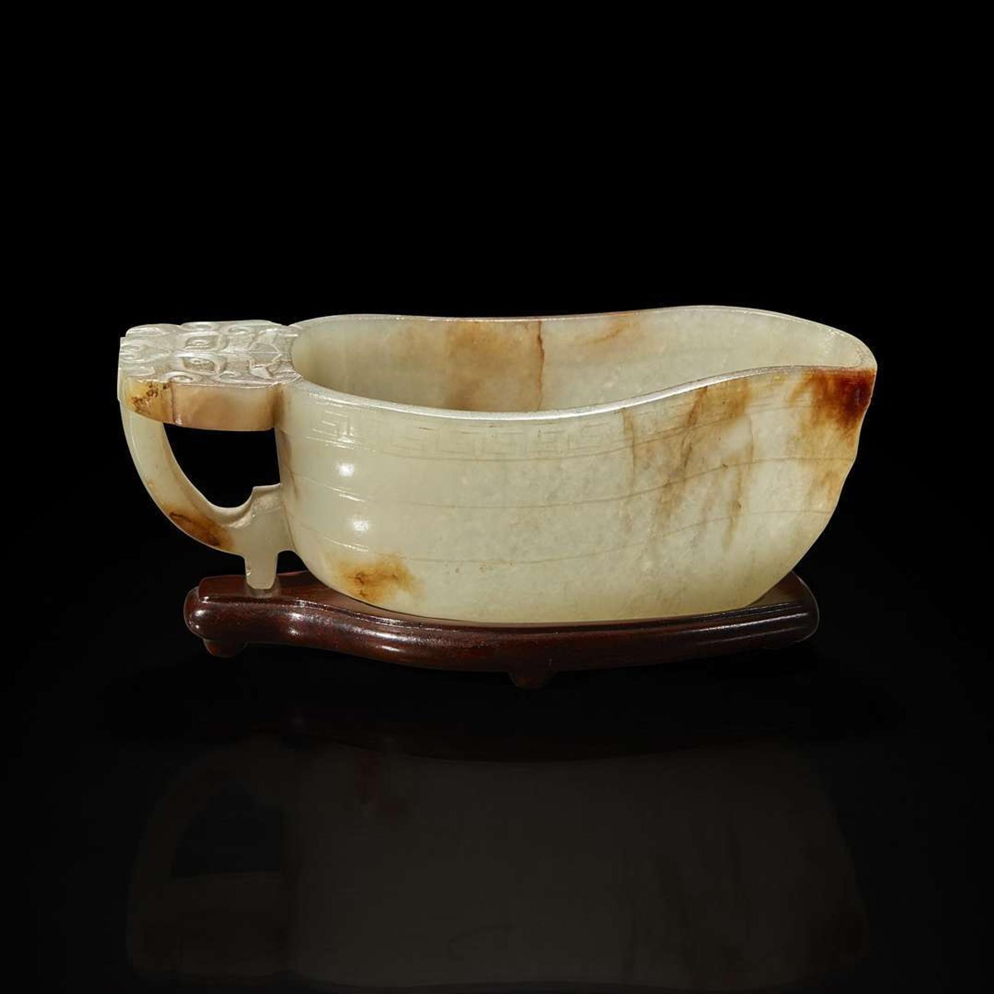 A Chinese pale celadon jade archaistic libation cup and a bronze rabbit seal 玉匜与铜兔印章一组 The jade 17th/18th Century, the seal possibly Yuan dynasty ?????????? ??????