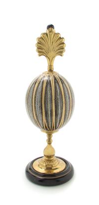 A Painted and Parcel Gilt Ostrich Egg Height overall 15 inches.