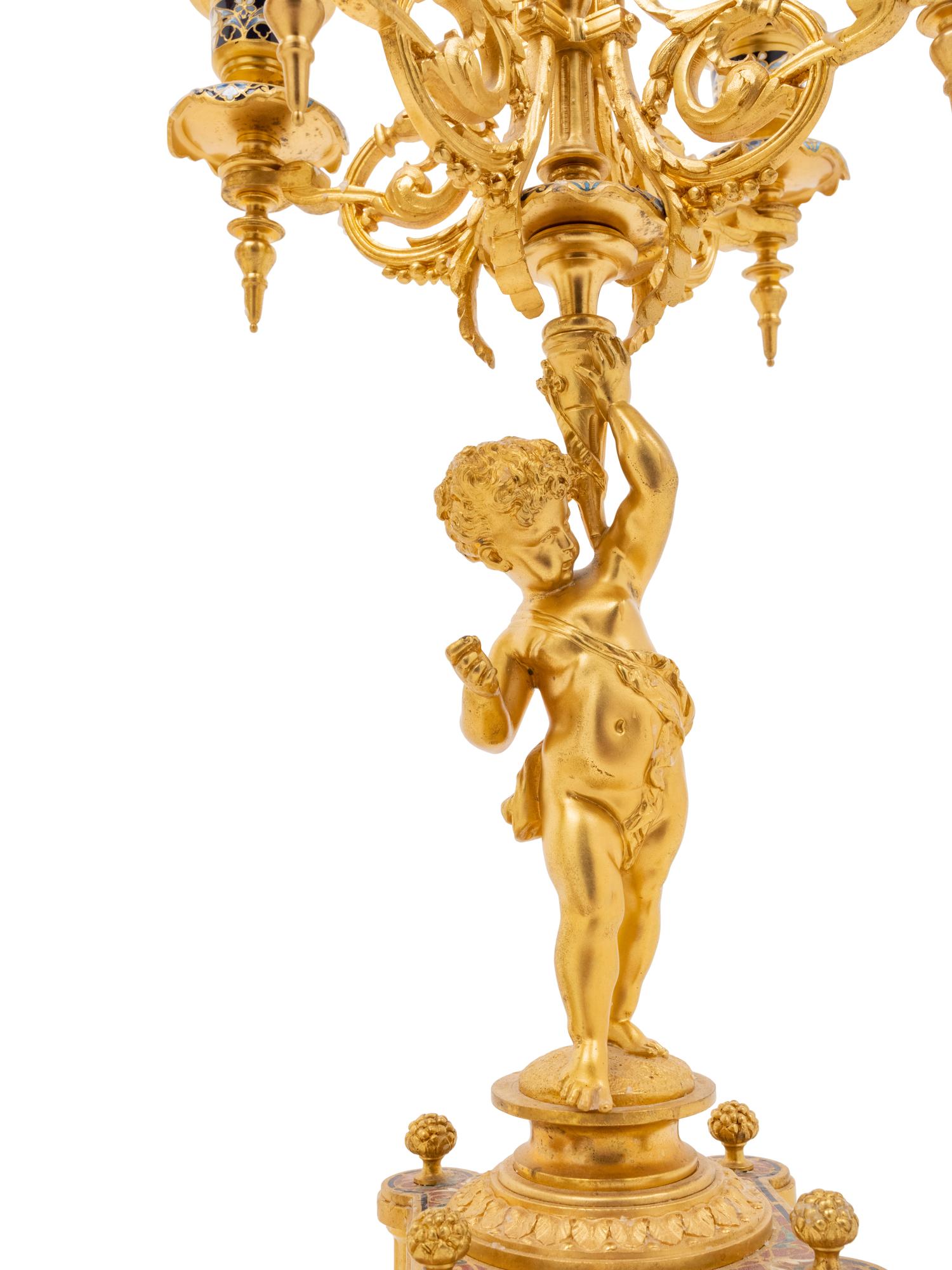 A Pair of French Gilt Bronze and Champlevé Five-Light Candelabra