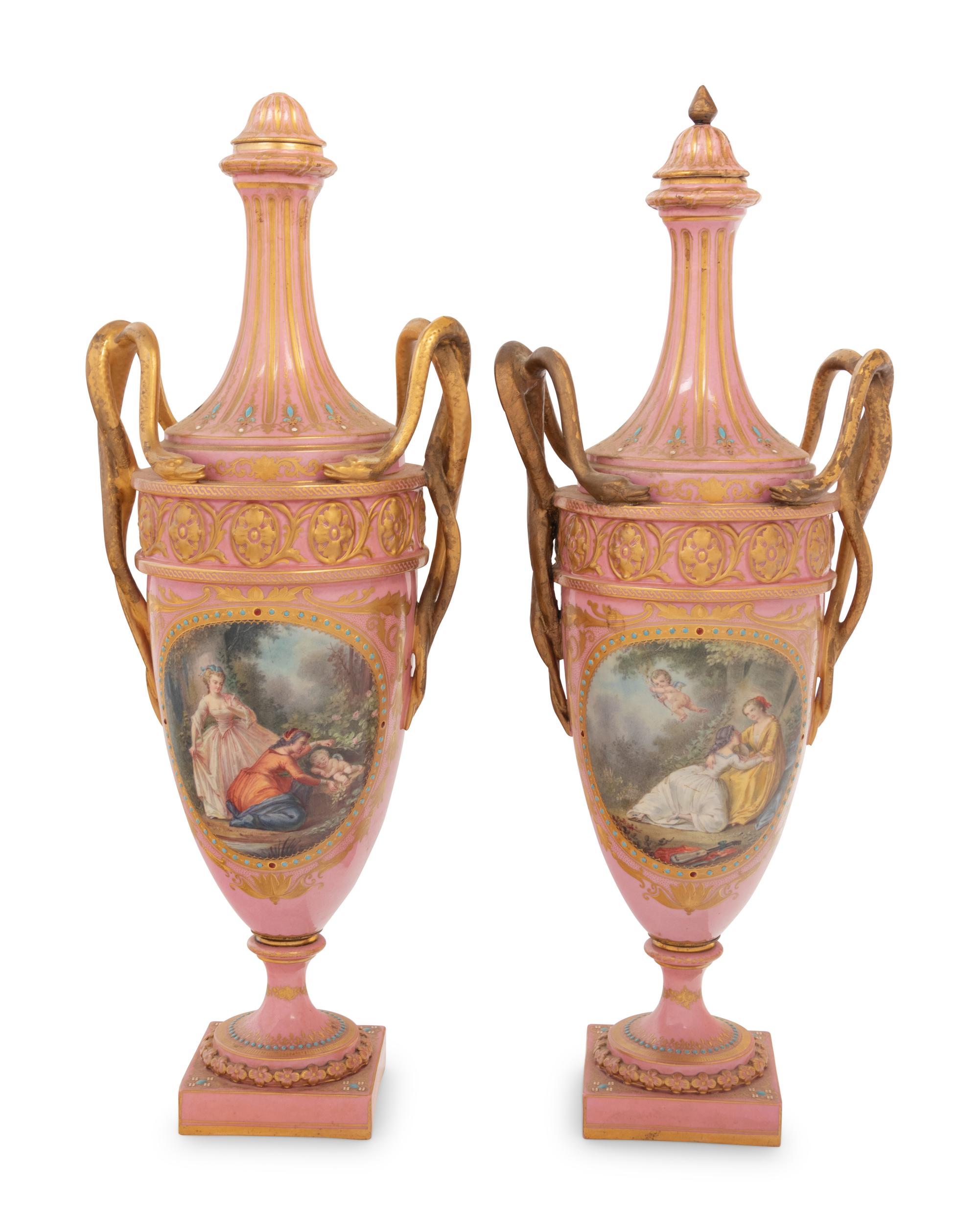 A Pair of Sèvres Style Parcel Gilt and "Jeweled" Porcelain Covered Urns