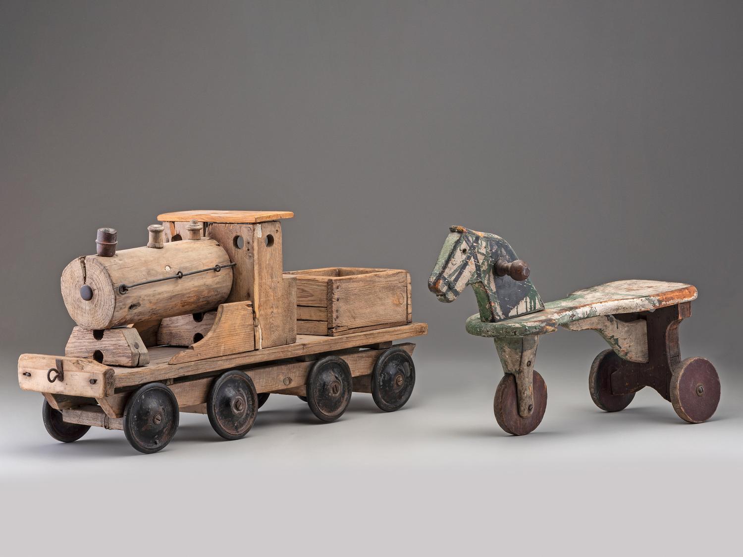 A Wooden Toy Train and Tricycle