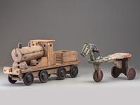 A Wooden Toy Train and Tricycle
