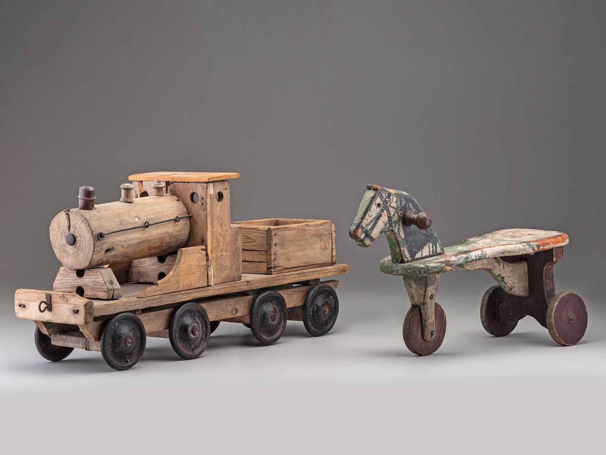 A Wooden Toy Train and Tricycle