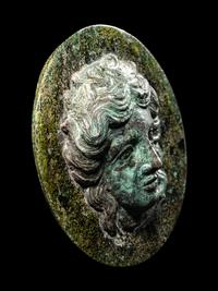 A Greek Bronze Mirror with the Head of a Woman