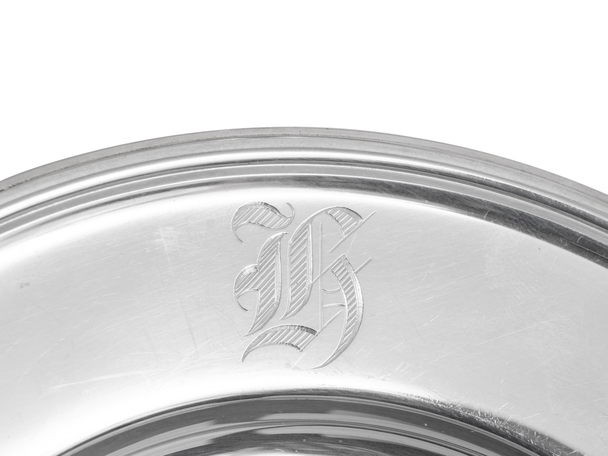 A Set of Eleven American Silver Bread Plates
