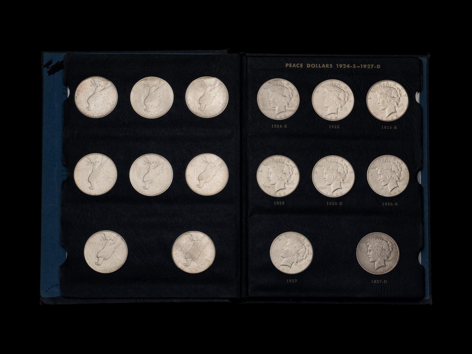 Two Sets of Peace $1 Coins
