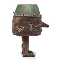 An Ashanti Carved and Gouged Painted Wood Breasted Drum