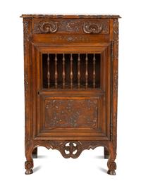 A French Provincial Carved Walnut Panettière