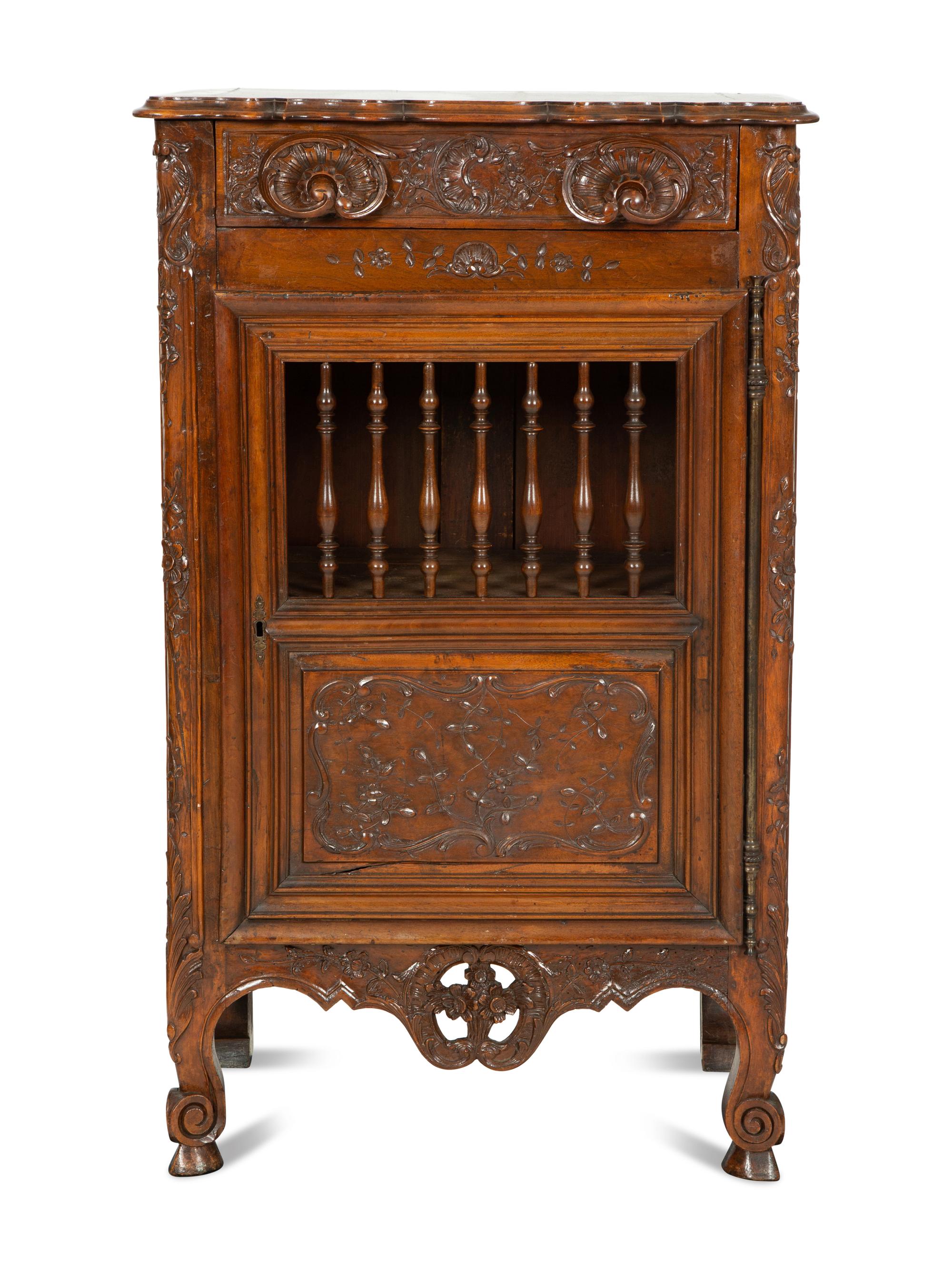 A French Provincial Carved Walnut Panettière