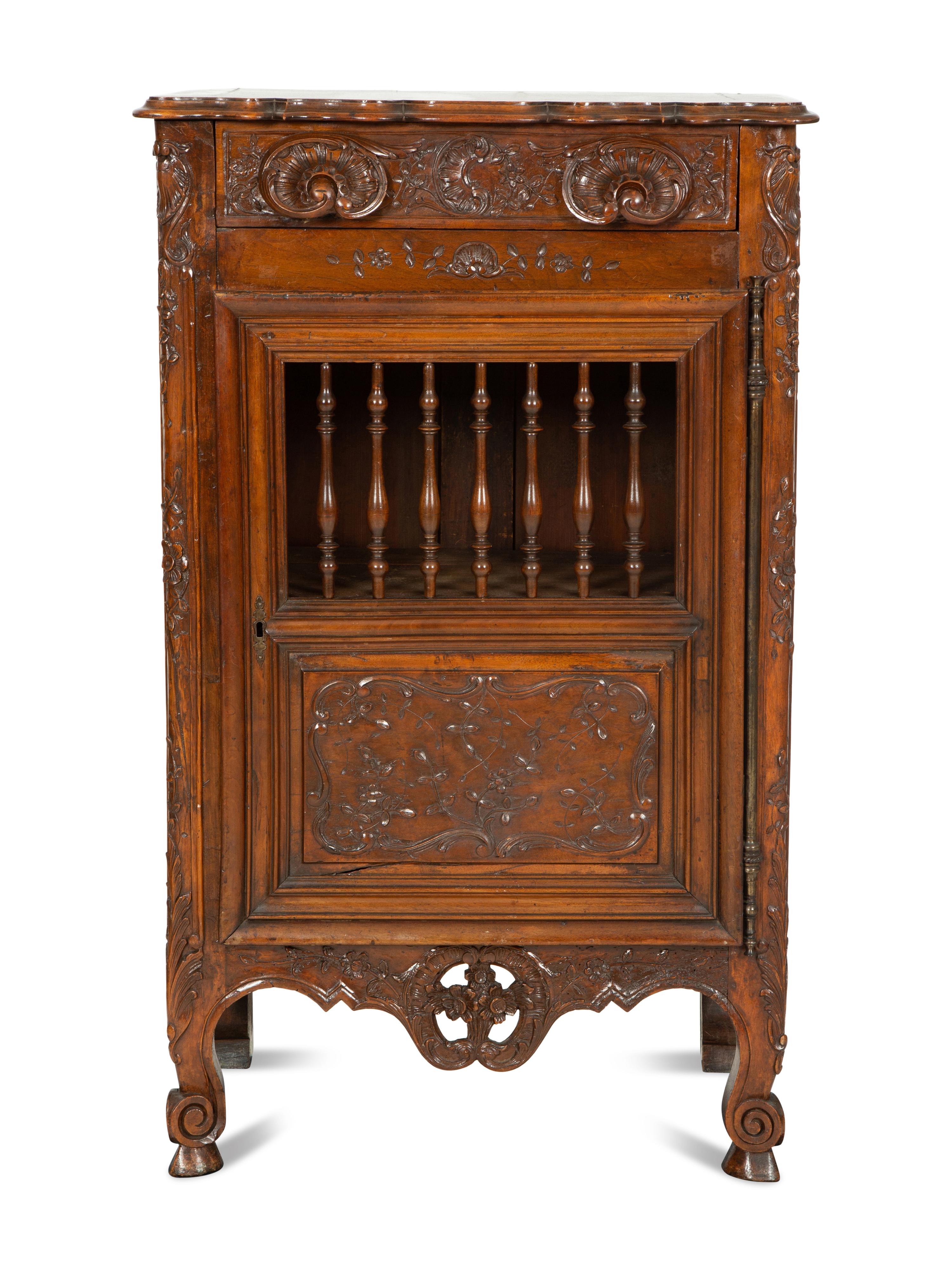 A French Provincial Carved Walnut Panettière