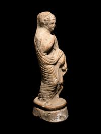 A Greek Terracotta Figure of a Young Woman