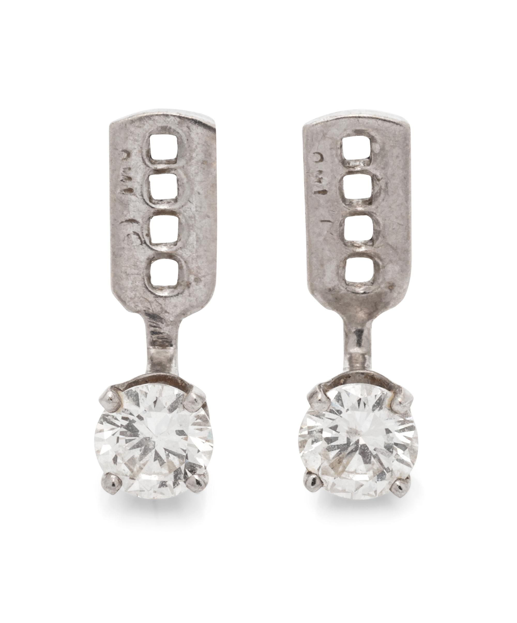 A Pair of 14 Karat White Gold and Diamond Earring Jackets,