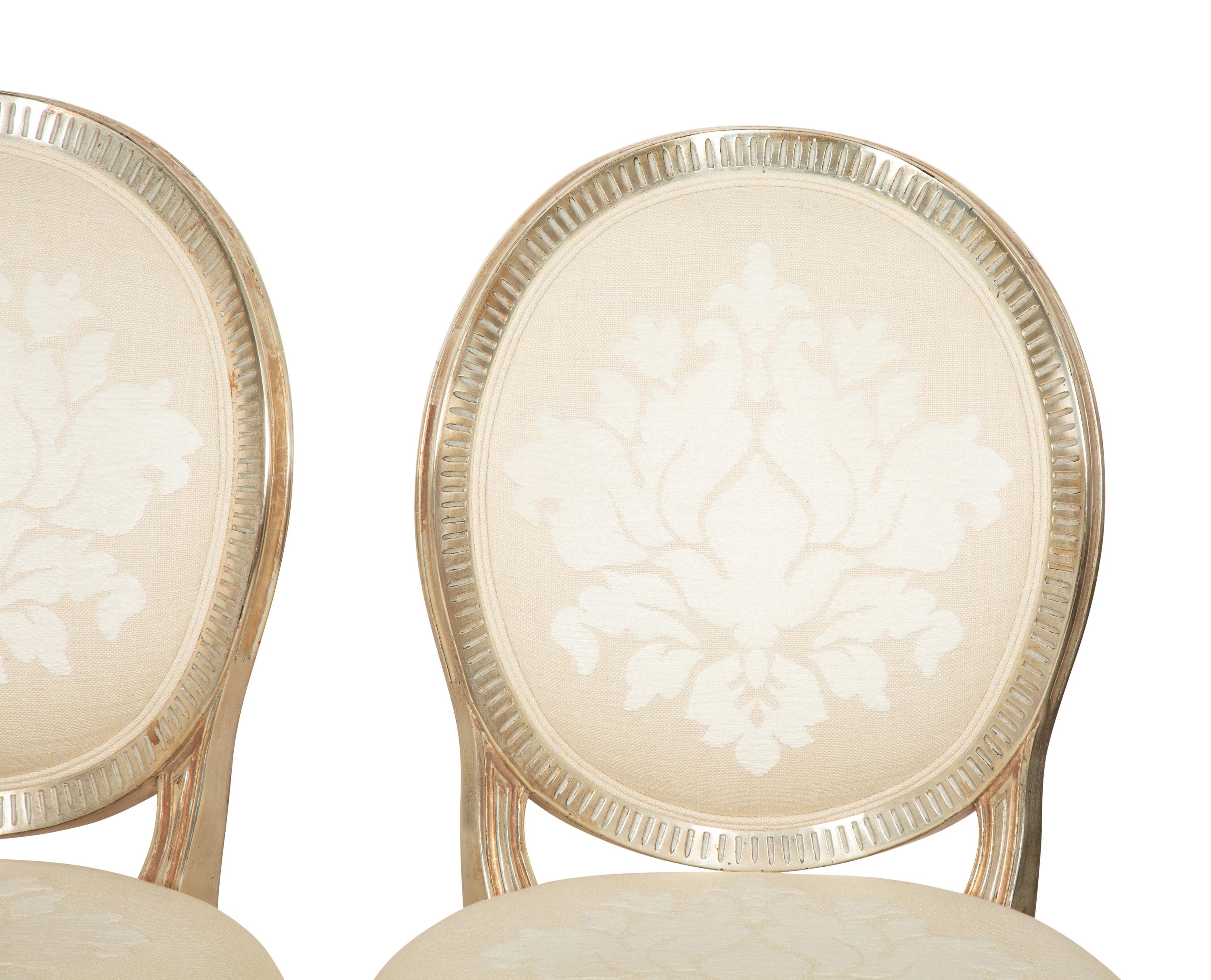 A Set of Twelve George III Style Silvered Wood Dining Chairs