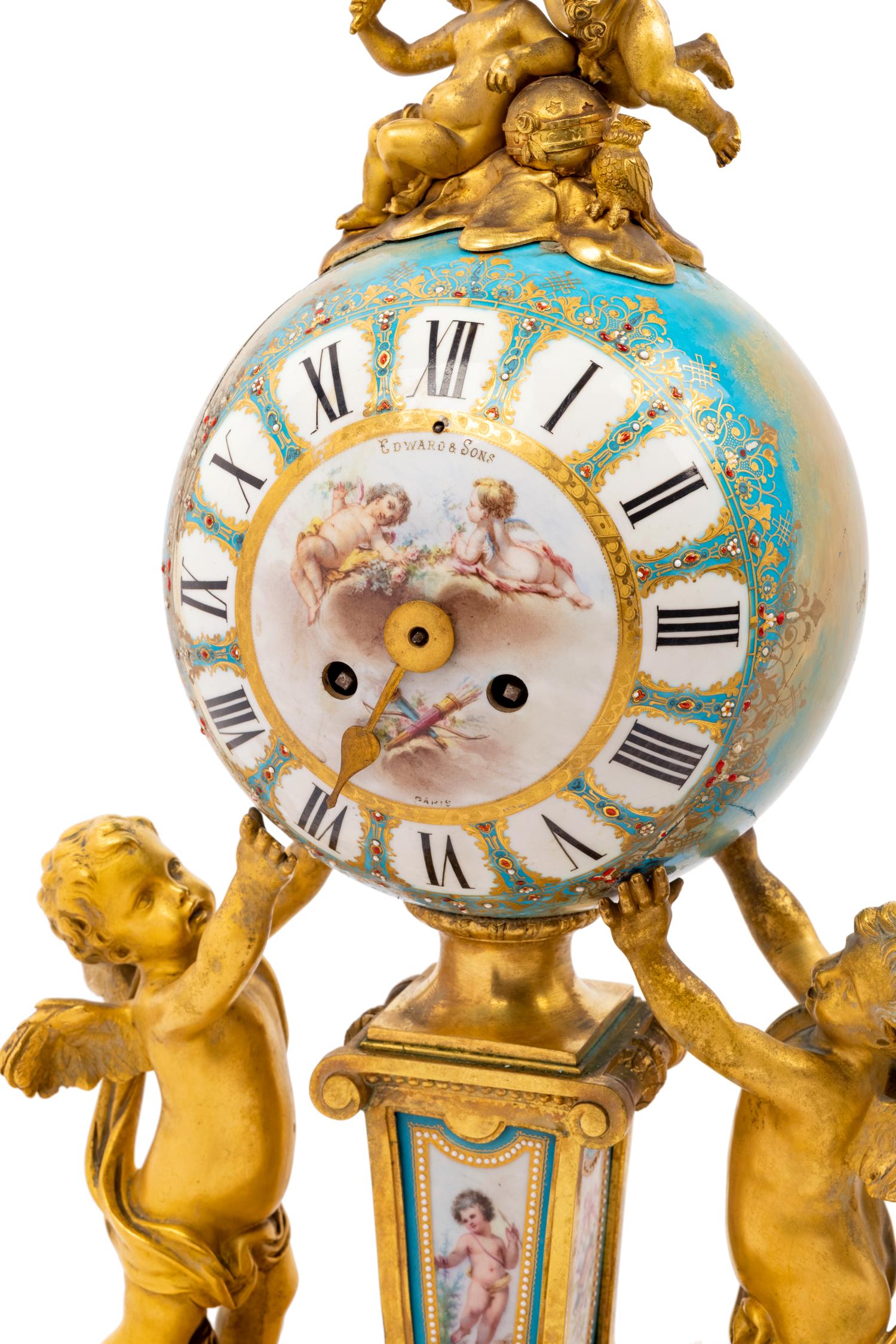 A Sèvres Style Porcelain and Gilt Bronze Mounted Three-Piece Clock Garniture