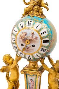 A Sèvres Style Porcelain and Gilt Bronze Mounted Three-Piece Clock Garniture