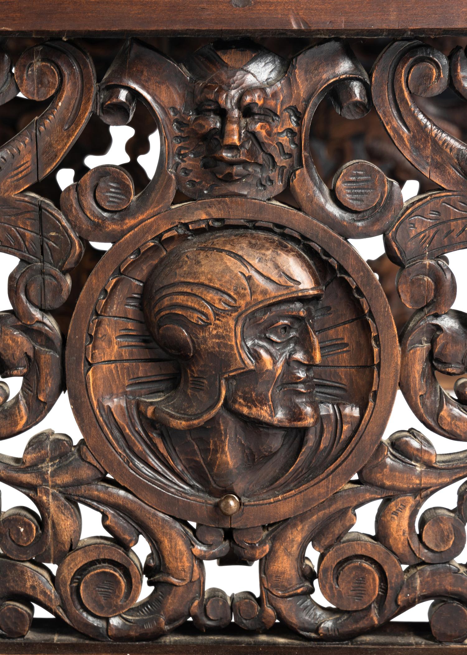 A Renaissance Revival Iron-Mounted Carved Walnut Library Table