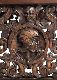 A Renaissance Revival Iron-Mounted Carved Walnut Library Table