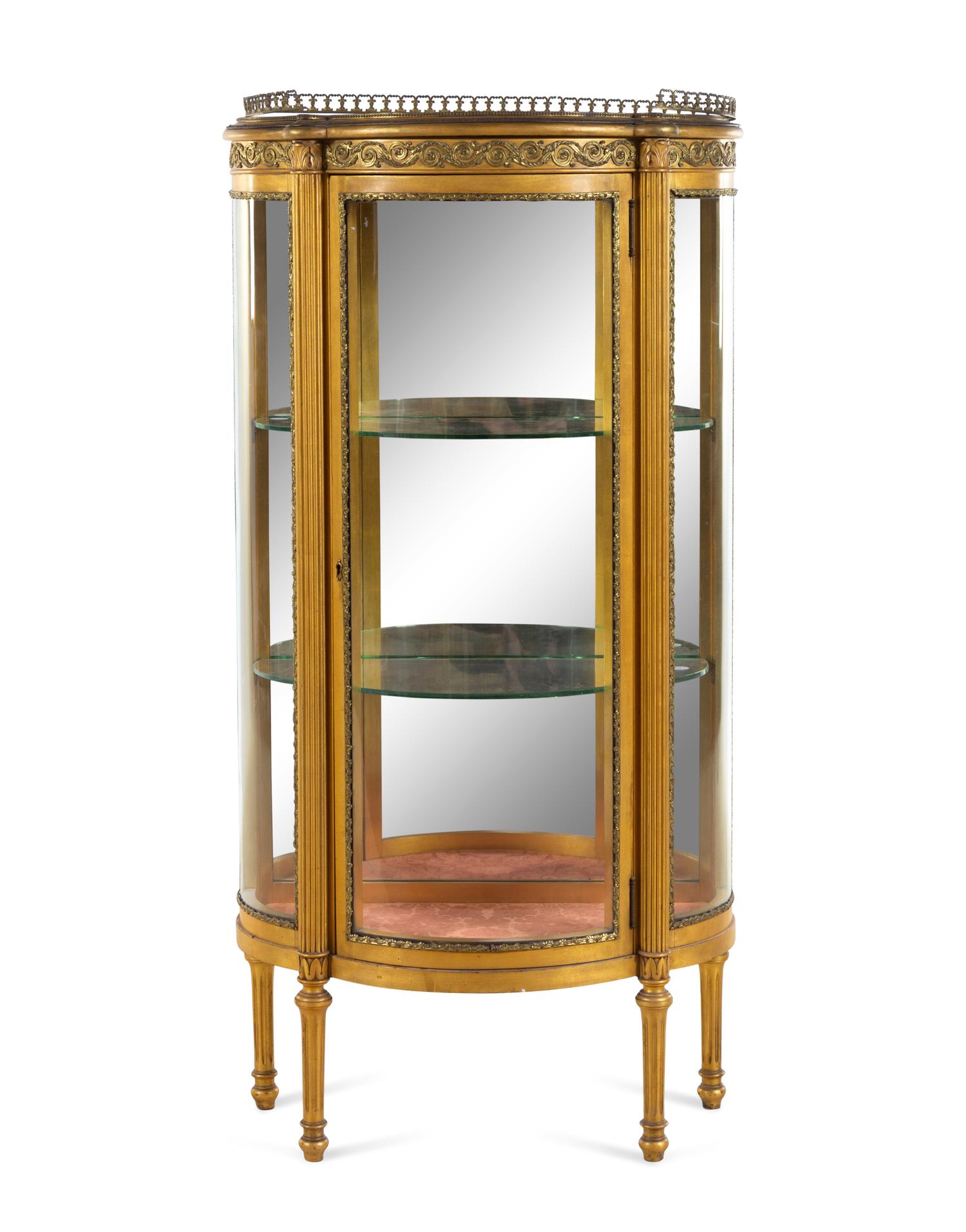 A Louis XVI Style Gilt Metal Mounted Giltwood Vitrine