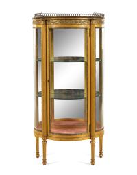 A Louis XVI Style Gilt Metal Mounted Giltwood Vitrine