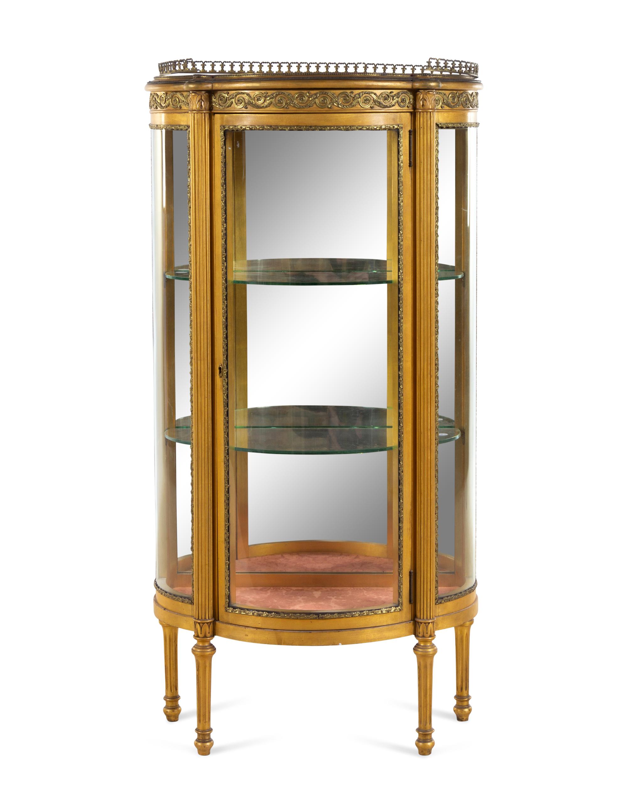 A Louis XVI Style Gilt Metal Mounted Giltwood Vitrine