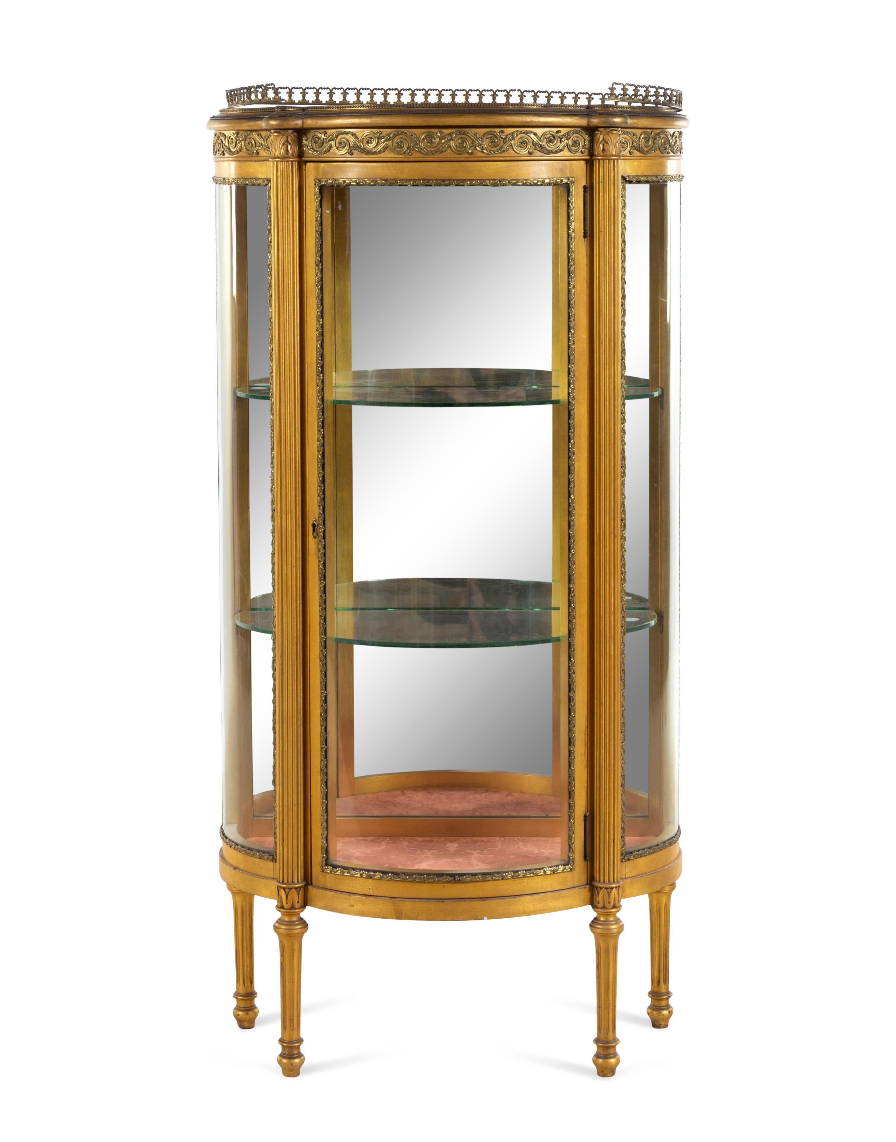 A Louis XVI Style Gilt Metal Mounted Giltwood Vitrine