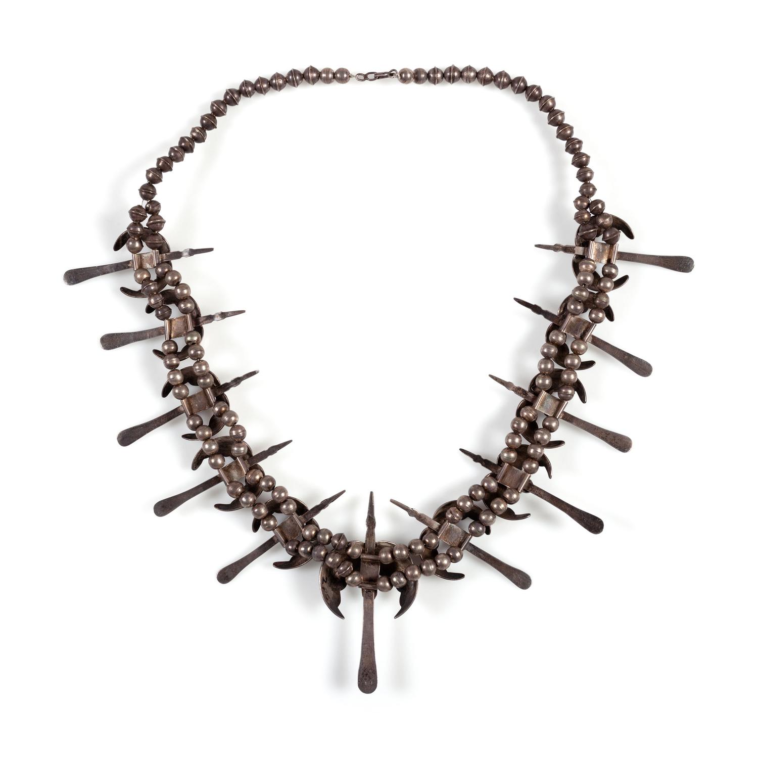 A Silver and Turquoise Peyote Bird Necklace