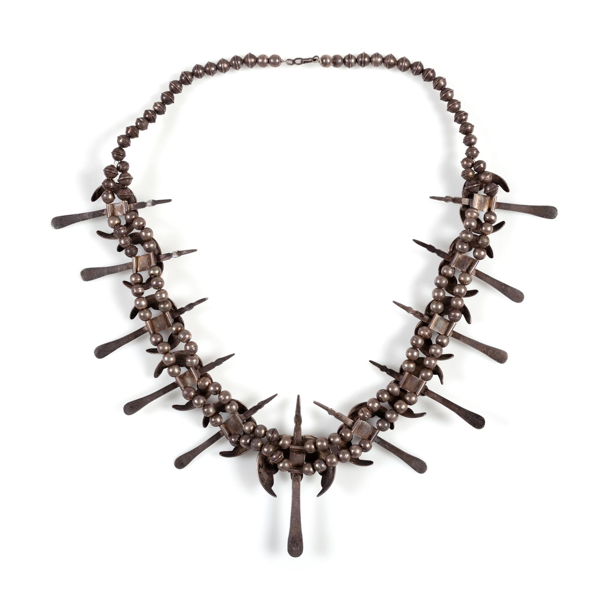 A Silver and Turquoise Peyote Bird Necklace