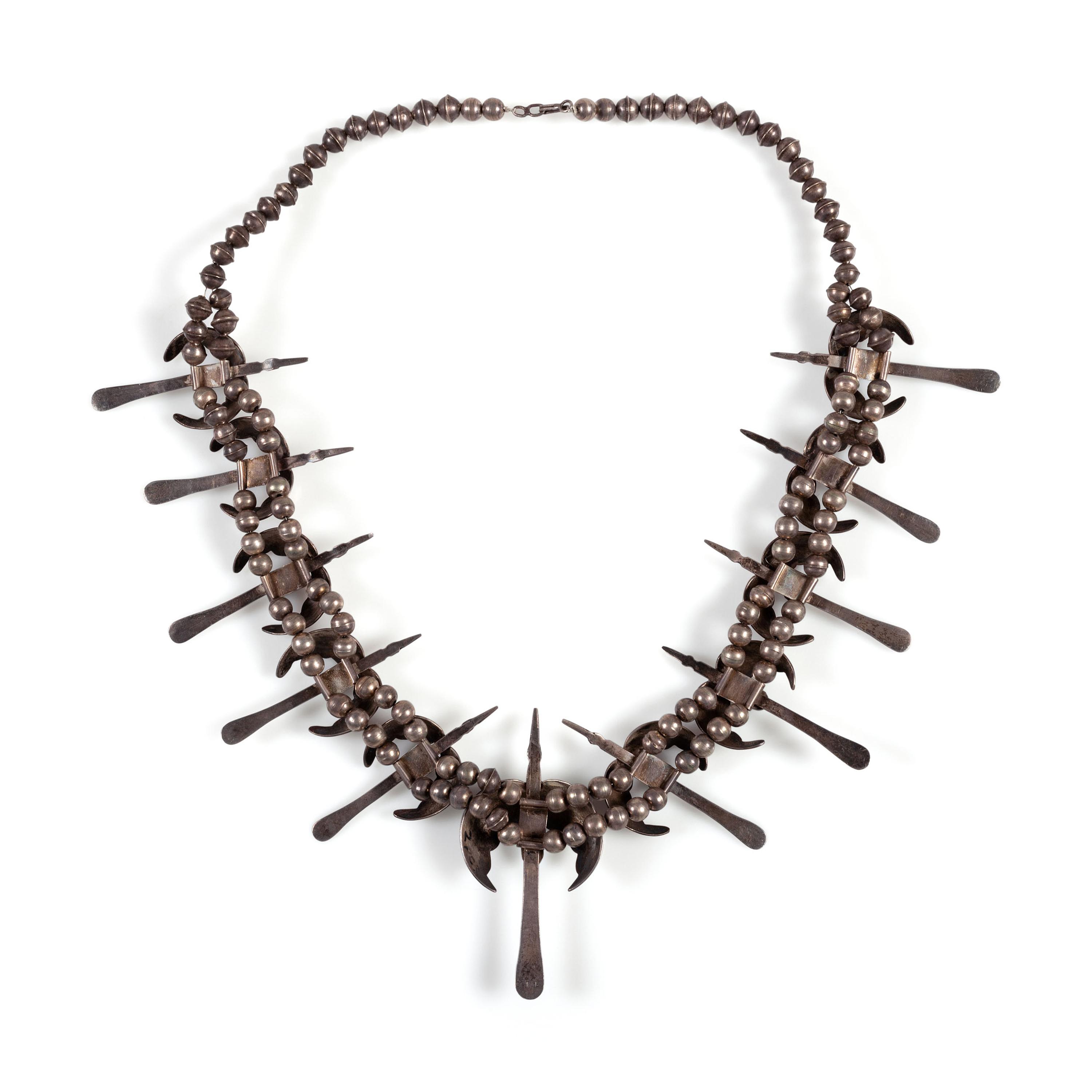 A Silver and Turquoise Peyote Bird Necklace