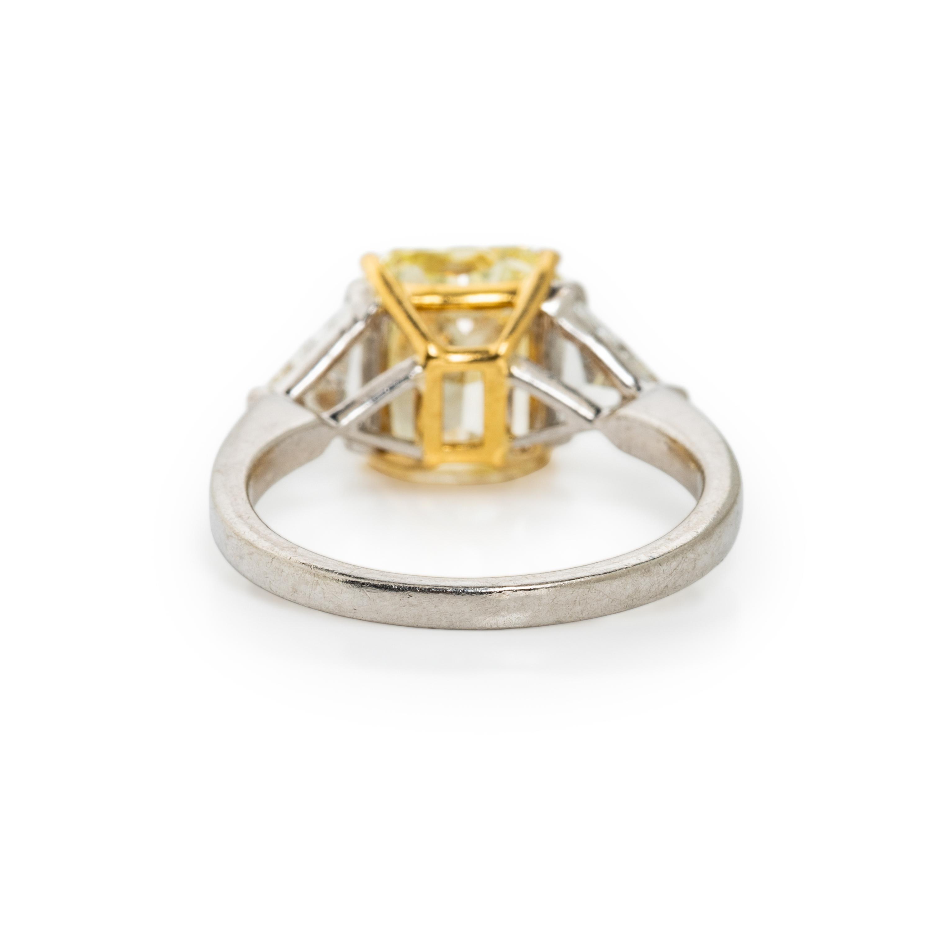 FANCY YELLOW DIAMOND, DIAMOND, AND PLATINUM RING
