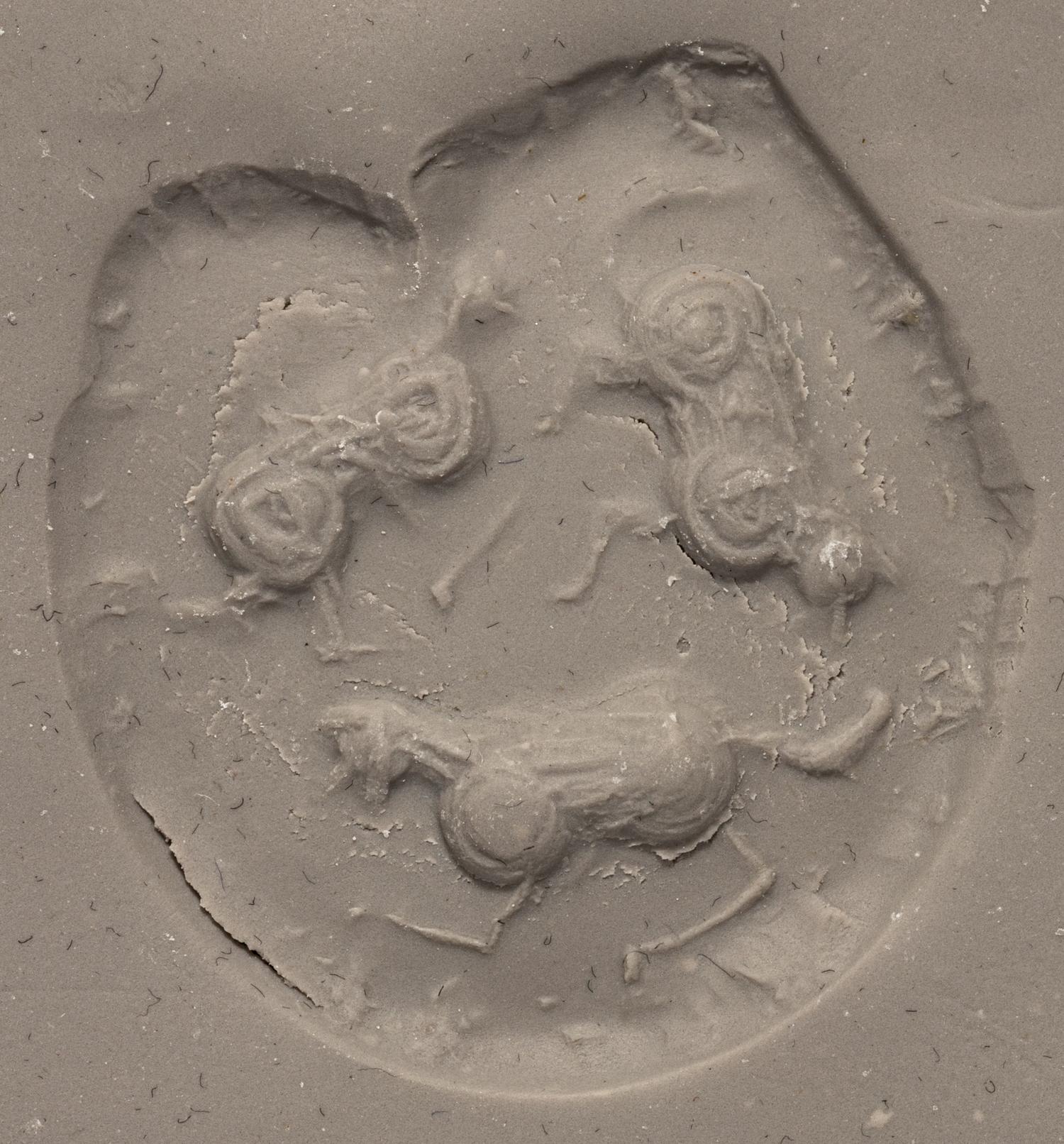 A Mesopotamian Yellow Jasper Stamp Seal with the Head of a Lion